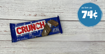 A bar of crunch chocolate on a wooden table.