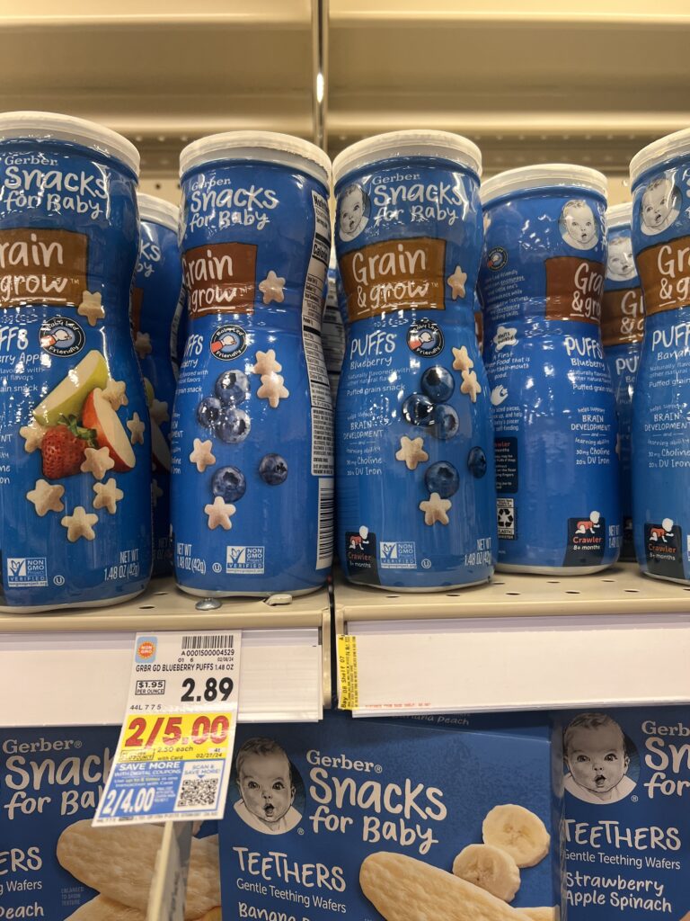 A display of baby snacks on a shelf in a grocery store.