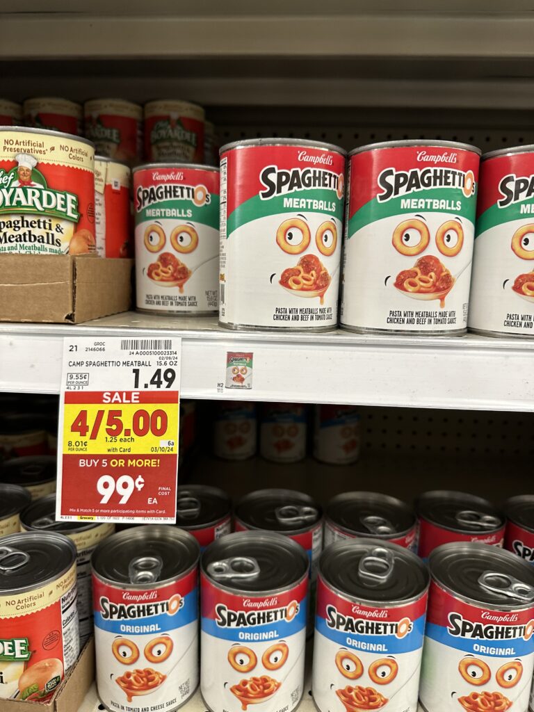 A shelf full of cans of spaghetti and meatballs.